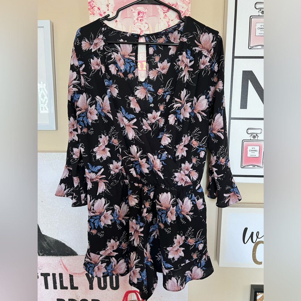 Adorable pink and blue floral romper! Great for date nights and summer strolls.